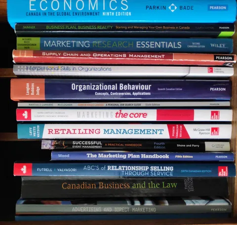 Business and Marketing textbooks on-hand that Adam still references occasionally